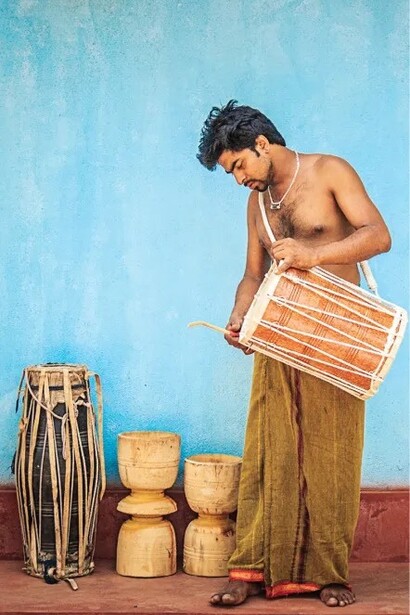 A man is busy making a traditional drum. They supply these traditional drums to drummers performing for temples and festivals. Village Kuragala in Sri Lanka