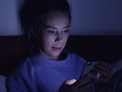 Frustration bubbles to the surface as she stares at her phone, grappling with the sudden loss of the comforting presence she once relied on