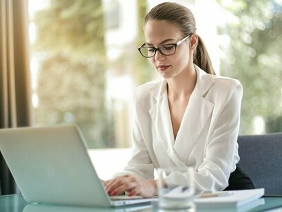 An employee working with enthusiasm and focus, representing the cultural shift toward worker-owned enterprises