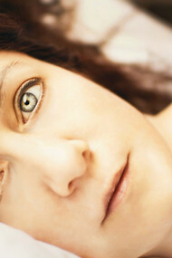 A woman unable to sleep, poor sleep quality has been linked to several medical conditions 