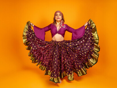 A woman in a purple frilly dress