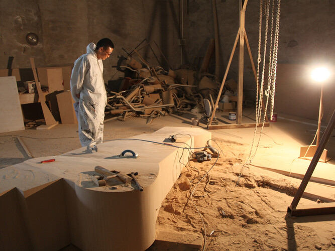 Wang Jianwei working at his Beijing studio, 2014. Photo: Xu Boxin, courtesy the artist. All works by Wang Jianwei © 2014 Wang Jianwei, used by permission.