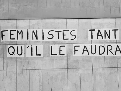 Feminist graffiti in Rouen, France, reading 'Feminists for as long as necessary'