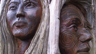 Maori tree carving of a woman and a man, from New Zealand