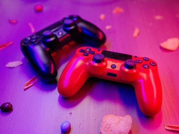 A pair of gaming controllers on a table, symbolising the ongoing debate over whether video games influence real-world violence