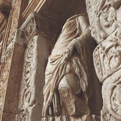 The Ennoia sculpture in the Library of Celsus, an ancient Greek figure set among the ruins of Ephesus, Turkey
