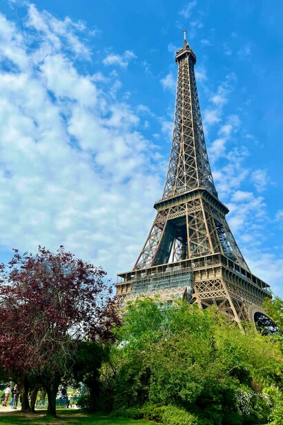 The Eiffel Tower rises against a clear blue sky in Paris, France