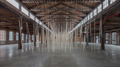 250 prepared ac-motors, 325kg roof laths, 1.8km rope Zimoun 2015. Motors, wood, rope, metal, power supplies. Dimensions: variable. Installation view: Knockdown Center NYC. Photography by Zimoun ©
