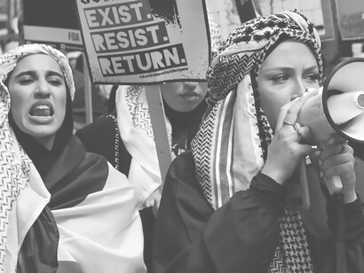 On Saturday, May 22, 2021, in London, UK, a woman participated in a protest for Palestine, donning a white hijab and a vibrant red long-sleeved shirt