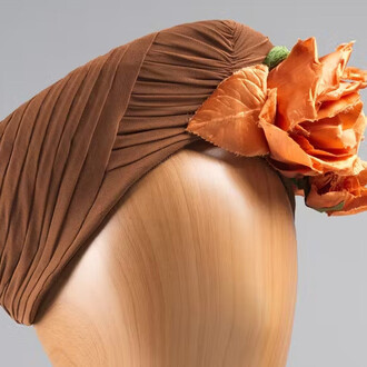 Gertrude's, Brown turban, 1941-45. Courtesy of the New-York Historical Society Gallery. Photo by Anna-Marie Kellen for the Smith College Historic Clothing Collection