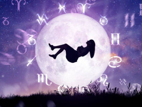 Astrology zodiac wheel with a woman in the center, representing the cosmos