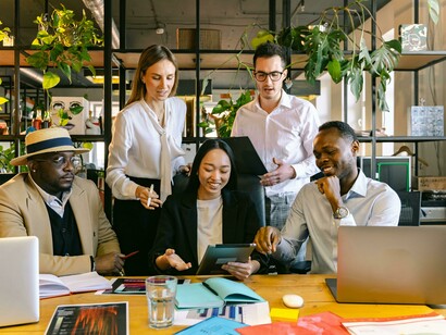 An open, diverse office space where people share ideas and work as equals