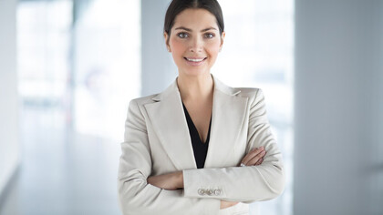 Confident and accomplished businesswoman with arms crossed, symbolizing economic participation, women in business, and female entrepreneurship