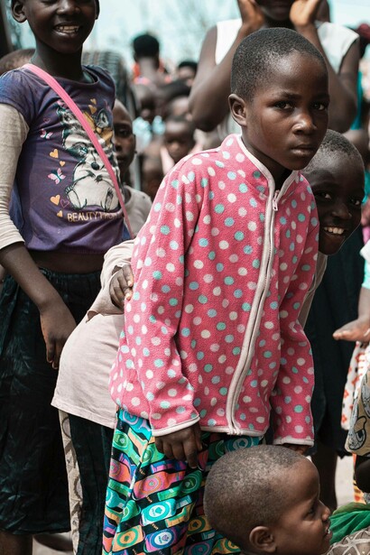 Child in a slum look into the distance