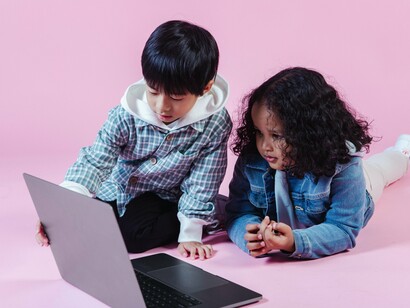 Children staring at laptop