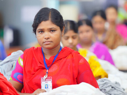 A garment worker operates a production line at a clothing factory in Bangladesh, photo by 
International Labour Organization 