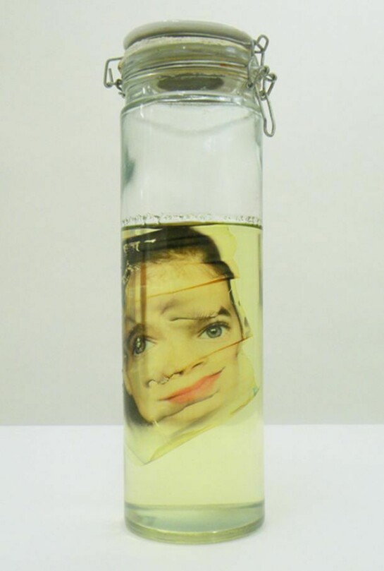 Face FSx Aborted, 2007-2013, 15 ¾ x 4 ¾ inches, 40 x 12 cm diameter - glass jar, printed china, oil and image printed on rhodoïd