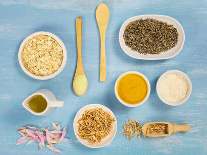 A variety of fresh herbs and spices, each offering unique healing properties that support Ayurvedic practices for balance and wellness