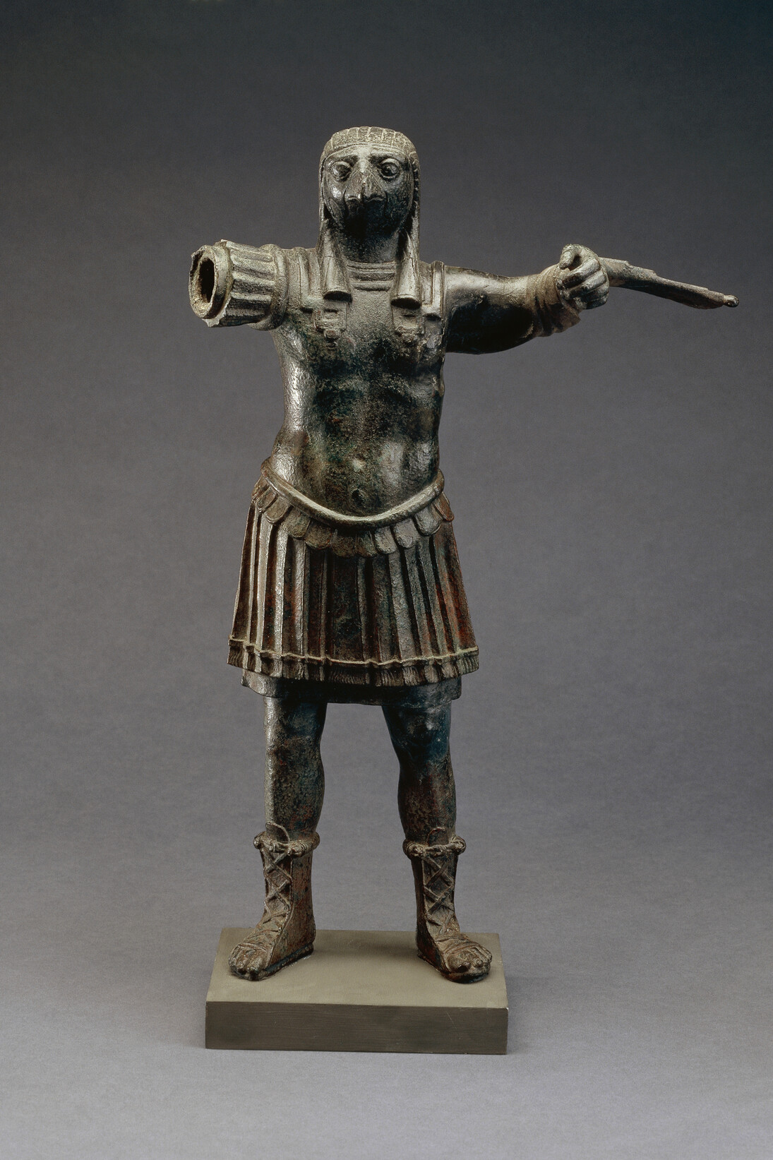 Standing figure of the Roman god Horus, wearing Roman military costume, bronze, Egypt, 1st–2nd century AD, © The Trustees of the British Museum