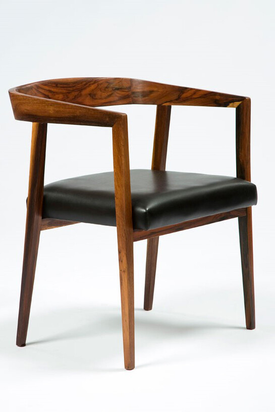 Joaquim Tenreiro, One of a set of four chairs in jacaranda with curved back and upholstered black vinyl seat. Designed by Joaquim Tenreiro, Brazil, 1960s. (seat 17" H) 19" L x 22" W x 28.5" H. Photo: Sherry Griffin © Joaquim Tenreiro. Courtesy:  Sean Kelly, New York with R & Company, New York