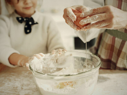 Cooking with your kids during the day symbolizes how working remotely enables better rest and balanced routines by fitting self-care into the day