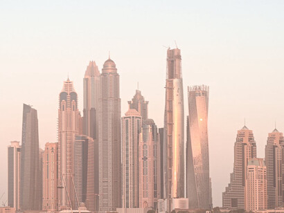 The skyline of Dubai at dusk, a city known for its riches, its glitzy and innovative architecture, a city capable of great growth and development