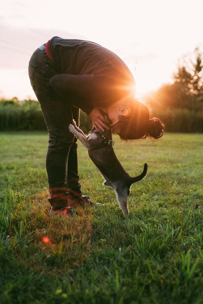 Person and a dog in a field