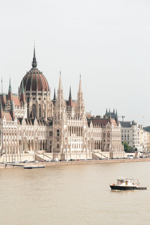 The Hungarian Parliament Building in Budapest, Hungary, with its stunning blend of Gothic Revival, Baroque, and Renaissance Revival architecture, stands as a symbol of the city's rich cultural and historical heritage