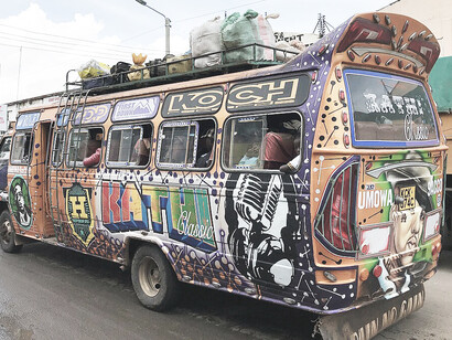 Matutu in motion in Nairobi, Kenya with Kathi Classic written on the side of the bus