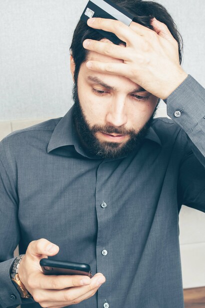 Man frustrated with a phone in his hand