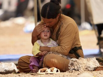 Woman and child in a refugee camp