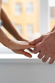 A young couple sharing intimate moments, holding hands with a deep connection