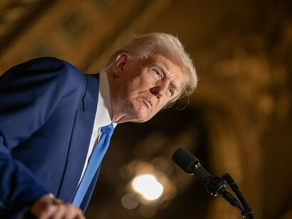 On February 18, 2025, President Donald Trump signs Executive Orders at his Mar-a-Lago resort in Palm Beach, Florida, addressing key policy changes