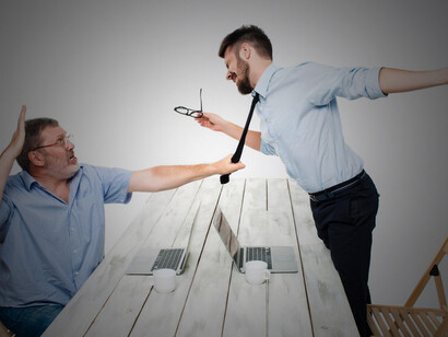 A business conflict, two men are portrayed expressing negativity, while one forcefully grabs the necktie of his opponent, reflecting tension and discord in the workplace