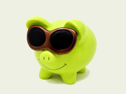 A piggy bank with sunglasses