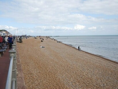 People on Hastings beach, England 