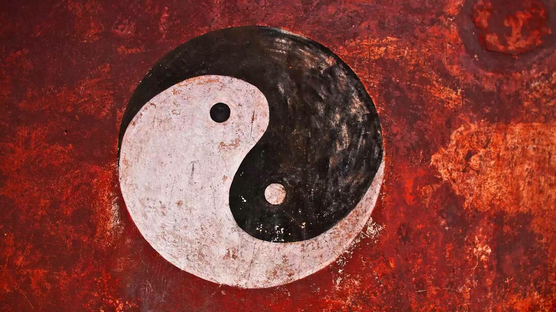The Taoist symbol in a bloodied red background