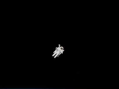 An astronaut floats in space without gravity