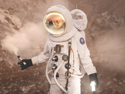 Male astronaut communicates his whereabouts while exploring an unfamiliar planet during a space mission