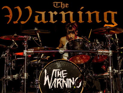 Paulina from The Warning commands the stage with her electrifying drum solos, pushing the boundaries of rhythm and energy, pictured here at their performance at the Magazzini Generali venue in Milan, Italy, on the 11th of April, 2024