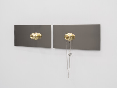 Alexander Shchurenkov, After (B&S), 2024.
High-polished stainless steel, brass doorknobs, metal pendants with Batman's and Superman's logo, chain. Courtesy of the artist and Fragment Gallery