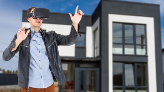 Man wearing VR glasses explores a new house design, showcasing VR technology in construction