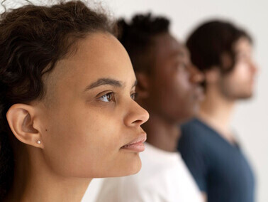 People from diverse cultures standing together, reflecting cultural diversity, biases, and communication challenges