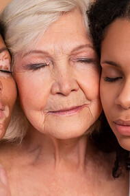 Women of different ages and diverse skin types posing together, celebrating natural beauty and individuality