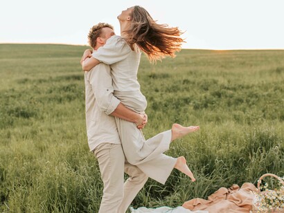 A man catching his partner in midair as they celebrate the wonderful date