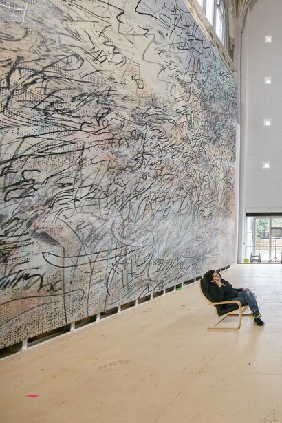 Julie Mehretu at work; courtesy the artist and Marian Goodman Gallery; © Julie Mehretu; photo: Tom Powel Imaging, Inc.