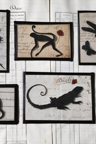 Small collage under antique handblown glass