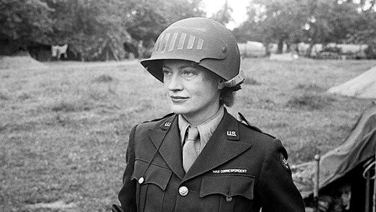 Lee Miller in steel helmet specially designed for using a camera, Normandy, France 1944 by unknown photographer Photographer Unknown © The Penrose Collection, England 2015. All rights reserved