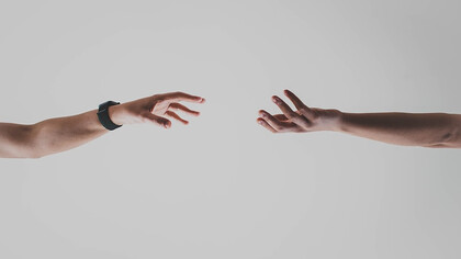 Two hands reaching out to connect