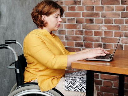 Woman works on her laptop